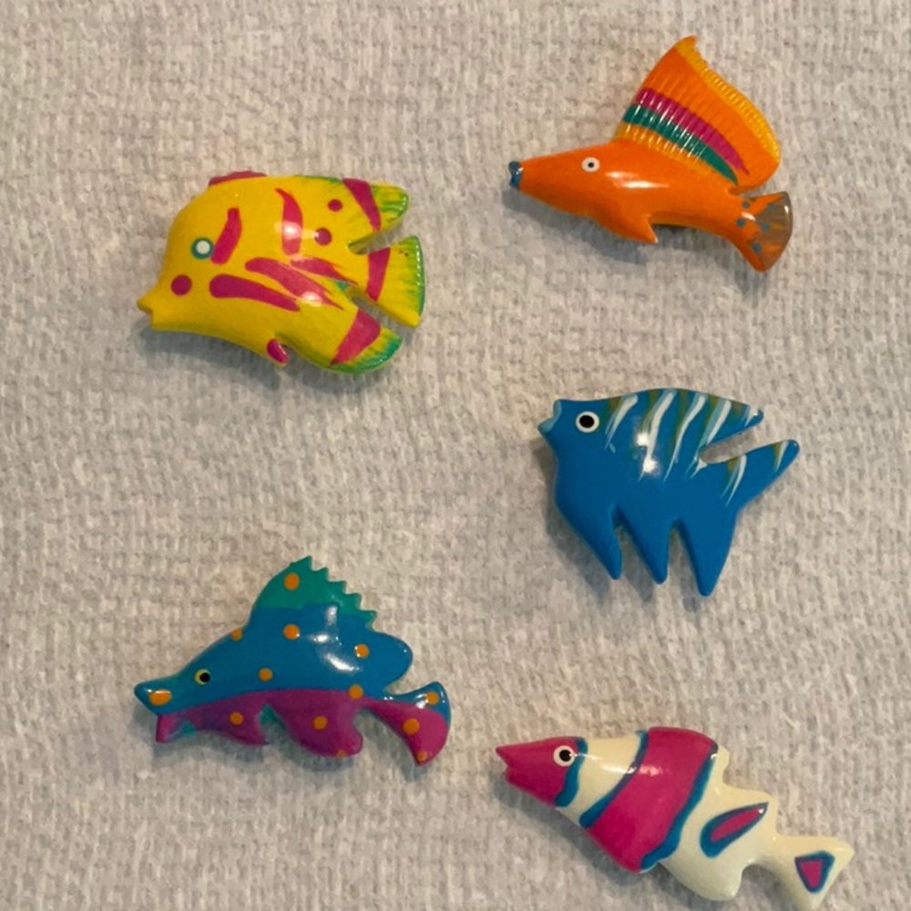 Five beautiful fish button covers. They each fit over a button. Never worn.